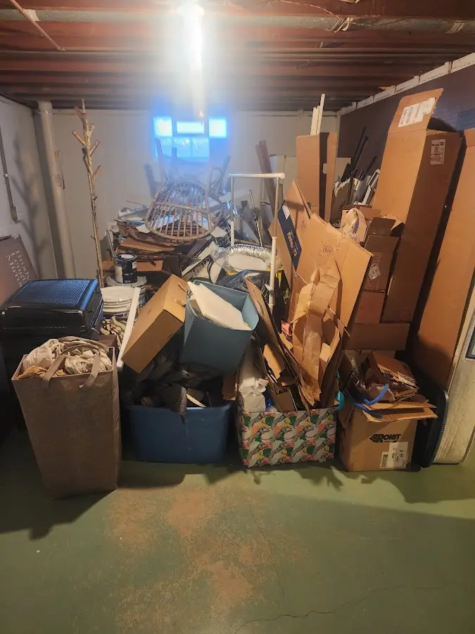 Roll-off dumpster container at job site for 4 Yard Dumpster Rental in Ross